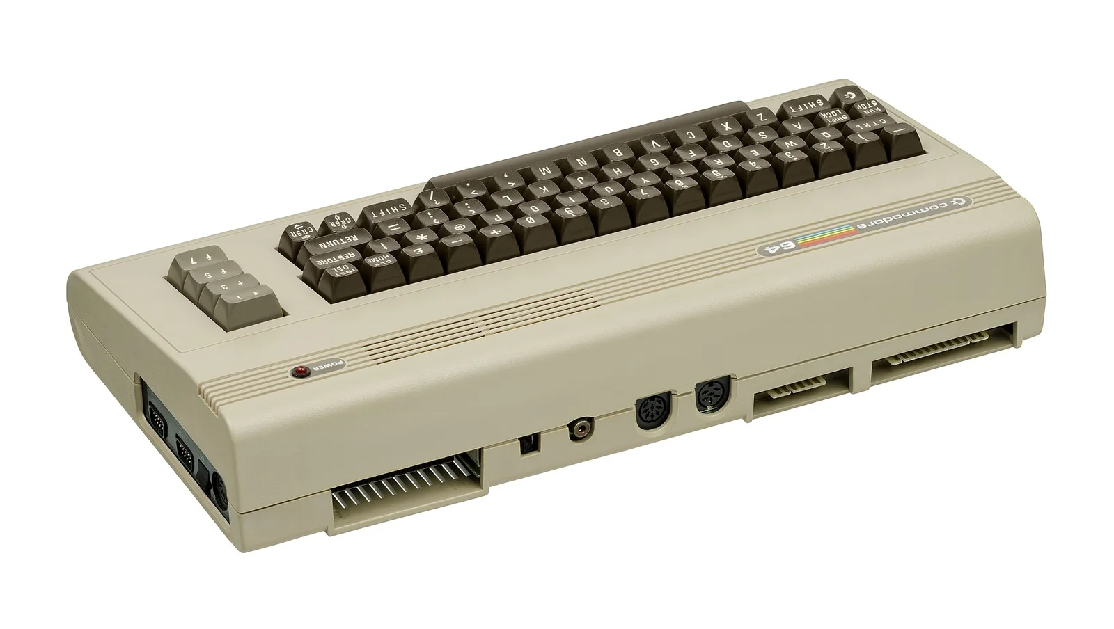 Commodore 64 背视图：卡带口、串口、用户口、射频与视频输出都焊在主板上。Evan-Amos 摄（Wikimedia Commons），公有领域。 · 图像文件署名：Evan-Amos；Public domain；网页缩放，原始文件保留。